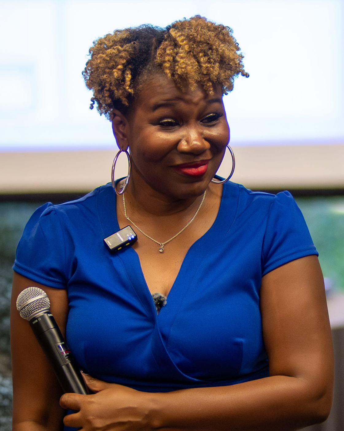 Vernita Bostick smiling, arms crossed, wearing a black blazer